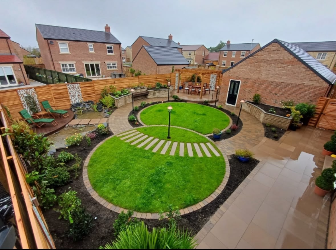 Landscaped rear garden with lawn, patio, decking and pergola