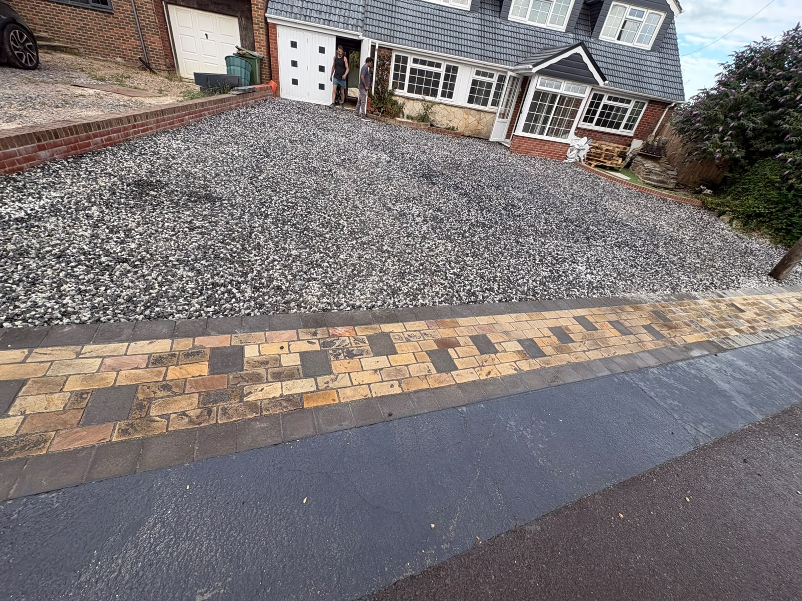 Black Ice decorative gravel driveway with new block paving kerb
