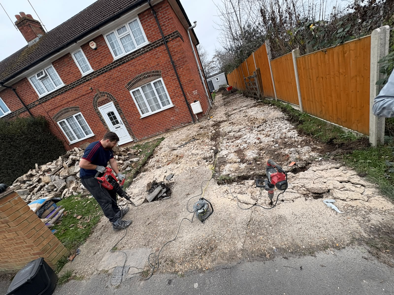 Charlie Adams from Direct Paving Group UK breaking out an old concrete driveway in Hampshire, ready for a full rebuild