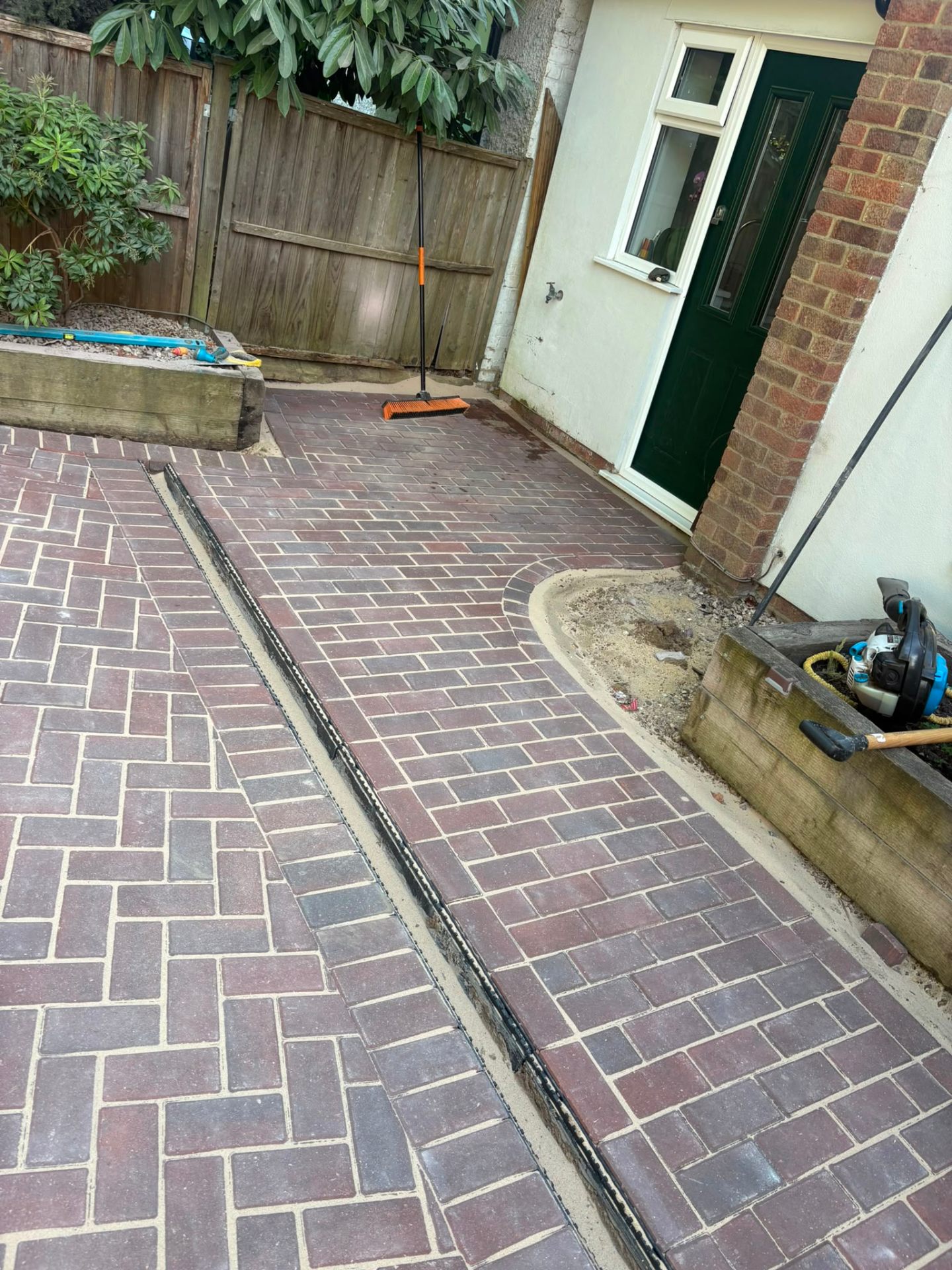 Block paving driveway with kerb, edging and gravel section combination